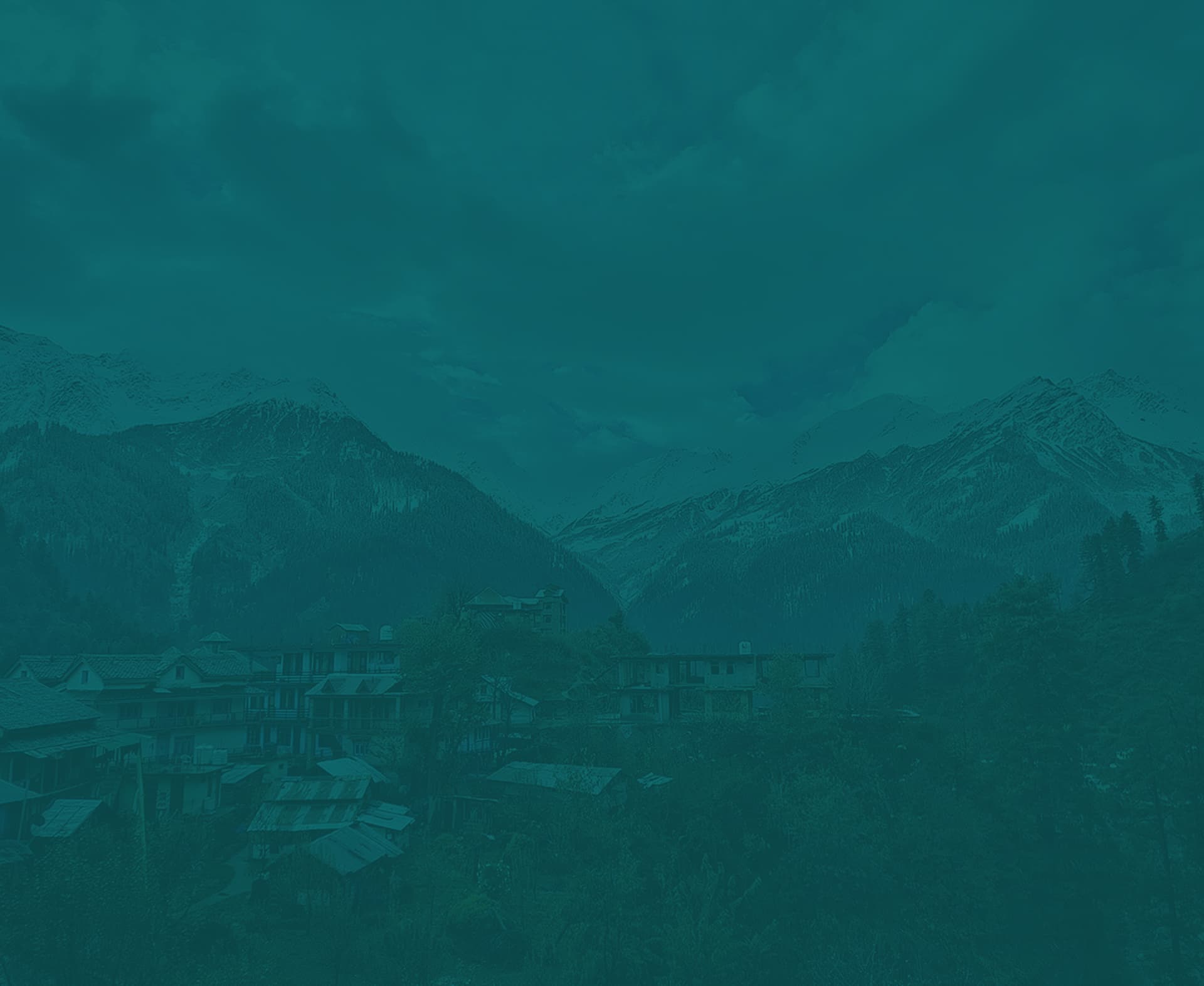Himachal Pradesh mountain village surrounded by snow peaks