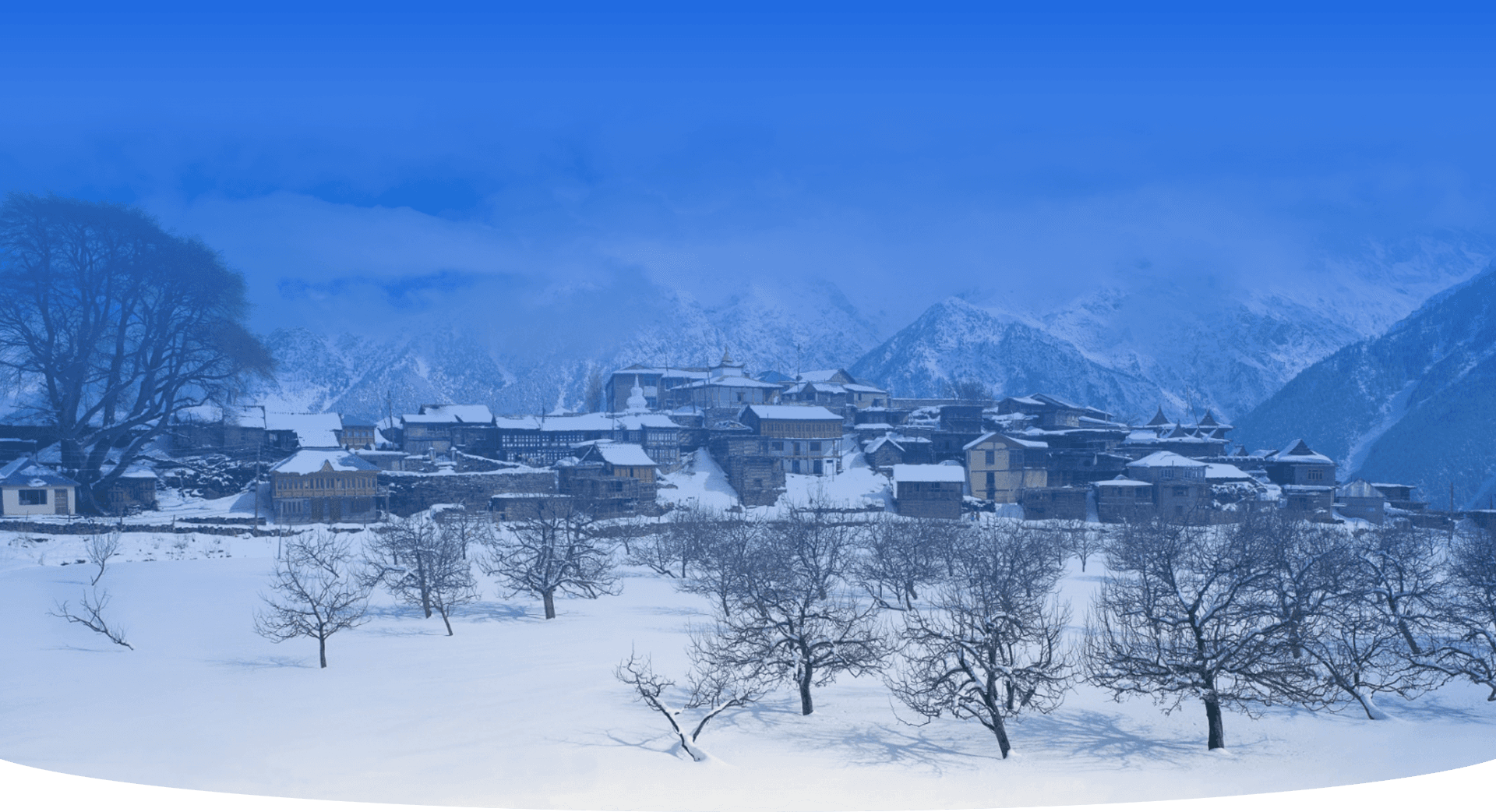 Snow-covered Himachal Pradesh village with traditional wooden houses