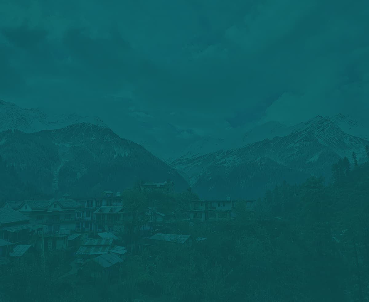 Himachal Pradesh mountain village surrounded by snow peaks