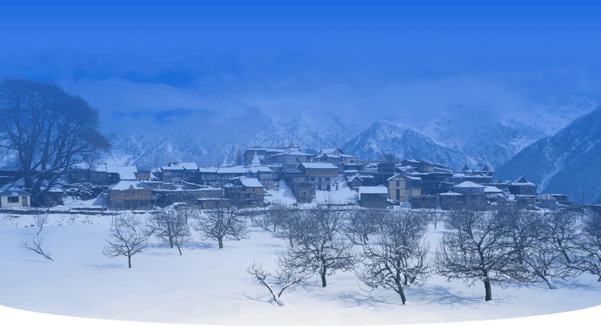 Snow-covered Himachal Pradesh village with traditional wooden houses